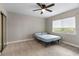 Comfortable bedroom with neutral paint, carpet, and a ceiling fan at 1140 S Orlando Ave # E11, Maitland, FL 32751