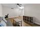 Bright living room featuring hardwood floors, a ceiling fan and neutral wall paint at 1140 S Orlando Ave # E11, Maitland, FL 32751