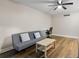 Cozy living room featuring hardwood floors, a ceiling fan and neutral wall paint at 1140 S Orlando Ave # E11, Maitland, FL 32751