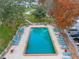 Aerial view of rectangular pool with chairs and views of the lake at 1140 S Orlando Ave # E11, Maitland, FL 32751