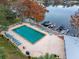 Aerial view of rectangular pool with chairs, boat docks, and beautiful lake views at 1140 S Orlando Ave # E11, Maitland, FL 32751