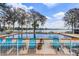 Lake view with lounge chairs lined along the pool deck at 1140 S Orlando Ave # E11, Maitland, FL 32751