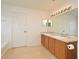 Bathroom featuring double vanity, large mirror, and tiled floor at 115 Bristol Forest Trl, Sanford, FL 32771