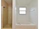 Bathroom features a shower and a bath tub at 115 Bristol Forest Trl, Sanford, FL 32771