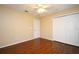 Bedroom features a ceiling fan, double closet and wood floor at 115 Bristol Forest Trl, Sanford, FL 32771