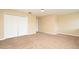 Neutral bedroom with carpet, paint, and bi-fold closet doors for an inviting living space at 115 Bristol Forest Trl, Sanford, FL 32771