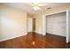Bedroom featuring hardwood floors, neutral paint, closet, and ceiling fan for extra air flow at 115 Bristol Forest Trl, Sanford, FL 32771