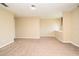 Spacious bedroom featuring neutral carpet, paint, and a transom window for extra light at 115 Bristol Forest Trl, Sanford, FL 32771