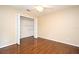 Bedroom with hardwood floors, neutral paint, and walk-in closet for extra storage at 115 Bristol Forest Trl, Sanford, FL 32771