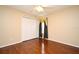 Bedroom featuring hard wood floors, neutral paint, and window with decorative shade at 115 Bristol Forest Trl, Sanford, FL 32771