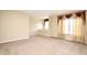 Bright bedroom featuring neutral carpet, paint, and draped windows for an inviting living space at 115 Bristol Forest Trl, Sanford, FL 32771