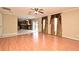 Open concept living room with wood floors leading to the kitchen at 115 Bristol Forest Trl, Sanford, FL 32771
