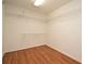 Empty walk-in closet with wire shelving and wood floor at 115 Bristol Forest Trl, Sanford, FL 32771