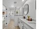 Bright bathroom with double sinks, modern shower, and stylish finishes at 11574 Buoy Point Pl, Orlando, FL 32832