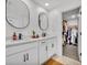 Double sink bathroom featuring modern fixtures, ample counter space, and a walk-in closet at 11574 Buoy Point Pl, Orlando, FL 32832