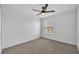 Bright bedroom with a ceiling fan, a neutral color scheme, and a window to allow natural light in at 11574 Buoy Point Pl, Orlando, FL 32832