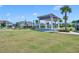 Community park featuring an event pavilion and a large grassy area perfect for outdoor activities and recreation at 11574 Buoy Point Pl, Orlando, FL 32832