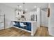 Modern kitchen with stainless steel appliances, a breakfast bar, and stylish lighting, perfect for cooking and entertaining at 11574 Buoy Point Pl, Orlando, FL 32832