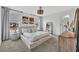 Serene main bedroom features large windows, a cozy rug, and a modern, relaxing design at 11574 Buoy Point Pl, Orlando, FL 32832