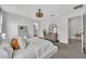 Comfortable main bedroom with neutral tones, modern decor, and ensuite bathroom at 11574 Buoy Point Pl, Orlando, FL 32832