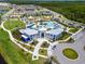 Beautiful aerial shot of a well maintained community clubhouse, pool, and playground at 11631 Mystery Ln, Orlando, FL 32832