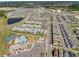 An aerial view of this Primary-planned community shows the proximity of a resort pool, tennis court, and playground at 11631 Mystery Ln, Orlando, FL 32832