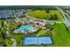 A beautiful resort-style pool, clubhouse, tennis court, playground, and lush landscaping make this a wonderful community at 11631 Mystery Ln, Orlando, FL 32832