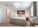 This cozy bedroom has a beachy decor with a queen-sized bed, side tables, and a closet at 11631 Mystery Ln, Orlando, FL 32832