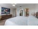 Comfortable bedroom leads to a bathroom with glass shower at 11631 Mystery Ln, Orlando, FL 32832