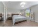 Bright bedroom featuring a comfortable bed, large window and closet at 11631 Mystery Ln, Orlando, FL 32832