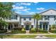 Charming townhouse with a well-manicured lawn, walkway, and attractive landscaping on a sunny day at 11631 Mystery Ln, Orlando, FL 32832