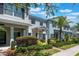 Charming townhome exterior featuring well-manicured landscaping and a welcoming entrance at 11631 Mystery Ln, Orlando, FL 32832