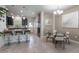 Modern kitchen open to the dining area, featuring dark cabinetry and stainless-steel appliances at 11631 Mystery Ln, Orlando, FL 32832