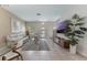 Inviting living room boasts tile floors, neutral paint, and an open floor plan to the dining area at 11631 Mystery Ln, Orlando, FL 32832