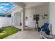 Covered patio space with potted plants, exercise equipment, and outdoor seating at 11631 Mystery Ln, Orlando, FL 32832