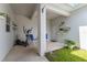 Covered patio area featuring potted plants, comfortable outdoor seating, and exercise equipment at 11631 Mystery Ln, Orlando, FL 32832
