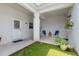 Covered patio features potted plants, comfortable seating, and sunshade, offering a relaxing outdoor space at 11631 Mystery Ln, Orlando, FL 32832