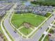 Stunning aerial shot of fenced playground in a well-maintained residential community with lush green space at 11631 Mystery Ln, Orlando, FL 32832