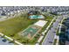 Beautiful aerial image of well-maintained basketball and sand volleyball courts in residential community at 11631 Mystery Ln, Orlando, FL 32832