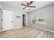 A well-lit bedroom features a ceiling fan, closet, and a window providing natural light at 124 Mcleods Way, Winter Springs, FL 32708