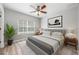 A serene bedroom featuring a comfortable bed, stylish furnishings, and bright natural light at 124 Mcleods Way, Winter Springs, FL 32708