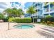 Community spa area featuring a hot tub, lounge seating, and lush landscaping for a tranquil escape at 124 Mcleods Way, Winter Springs, FL 32708