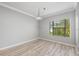 Empty room with wood floors, neutral paint, and a large window at 124 Mcleods Way, Winter Springs, FL 32708