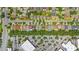 This aerial view showcases the neighborhood's layout, and lush tree coverage at 12917 Grovehurst Ave, Winter Garden, FL 34787