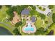 This aerial view highlights a community recreational area with a pool, playground, and green spaces at 12917 Grovehurst Ave, Winter Garden, FL 34787