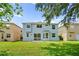 Expansive backyard featuring lush green grass, perfect for outdoor activities and relaxation at 12917 Grovehurst Ave, Winter Garden, FL 34787