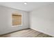 The bedroom has wood floors, white walls and trim, and a window at 12917 Grovehurst Ave, Winter Garden, FL 34787