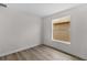 The bedroom has wood floors, white walls and trim, and a window at 12917 Grovehurst Ave, Winter Garden, FL 34787