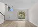Bright entryway with a soaring ceiling, large windows, and freshly painted walls at 12917 Grovehurst Ave, Winter Garden, FL 34787