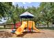 Colorful playground with slides and climbing structures, perfect for Gathering fun in a community area at 12917 Grovehurst Ave, Winter Garden, FL 34787